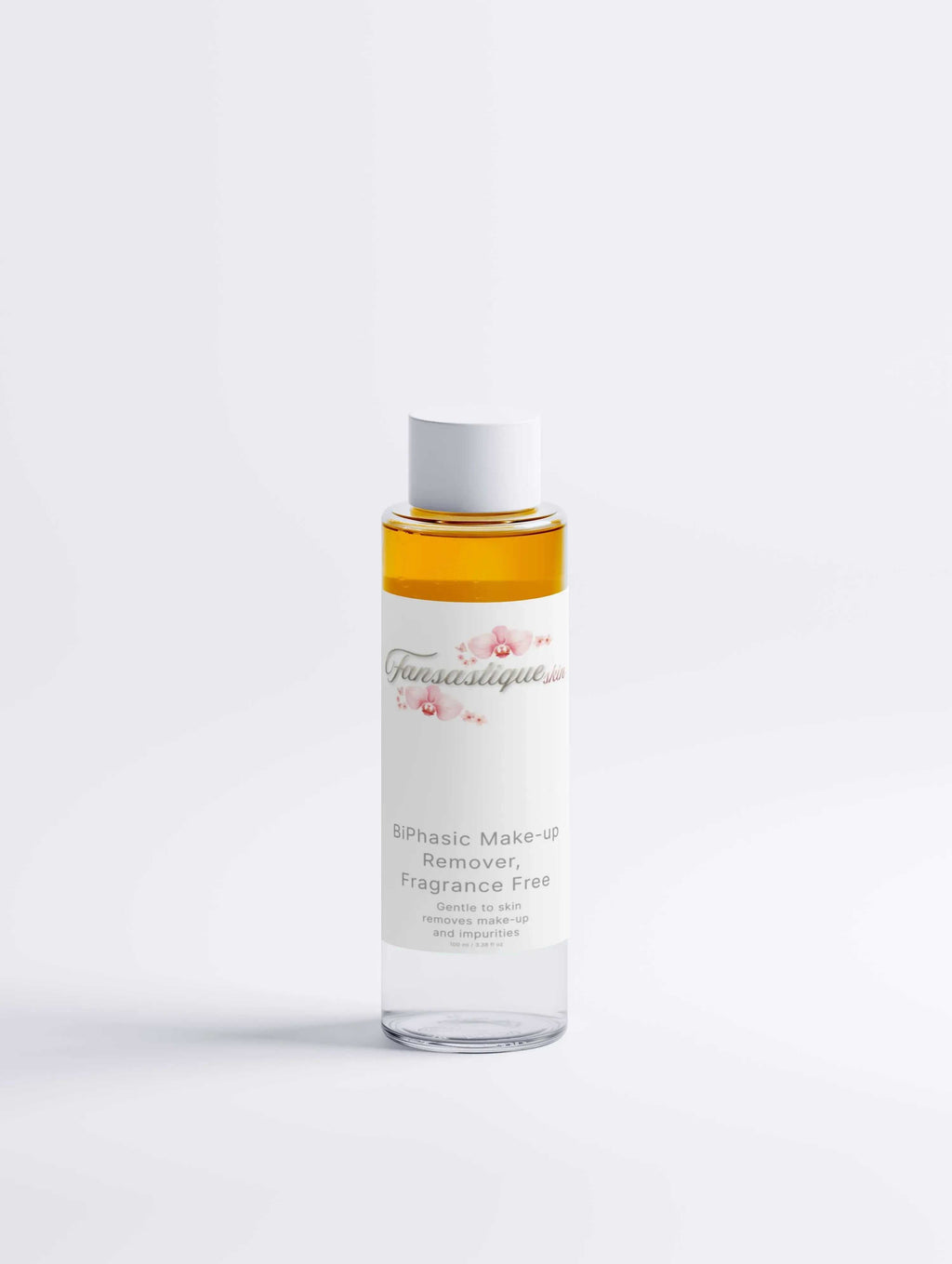 Biphasische make-up remover zonder parfum, doorzichtige fles tegen witte achtergrond